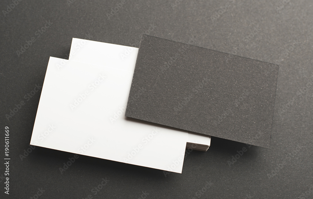 Black and white business card on black background. Mockup. Stock Photo