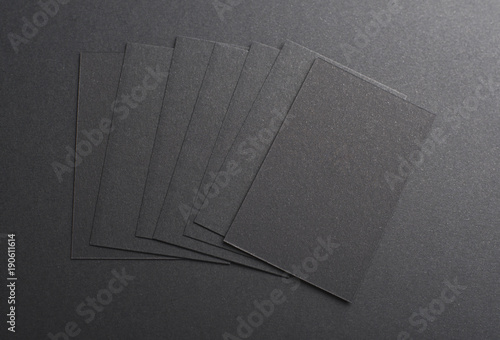 Black business card on black background. Mockup.