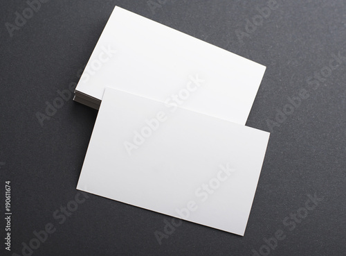 White business card on black background. Mockup.