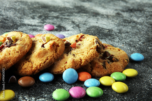 Chocolate cookies with colorful candies. Chocolate chip smarties cookies. photo