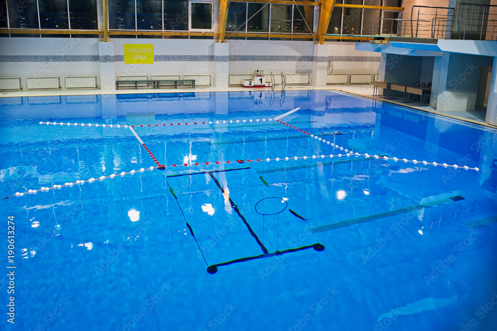 Empty swimming pool, clear water surface. Calm before aquatlon competition-underwater struggle.