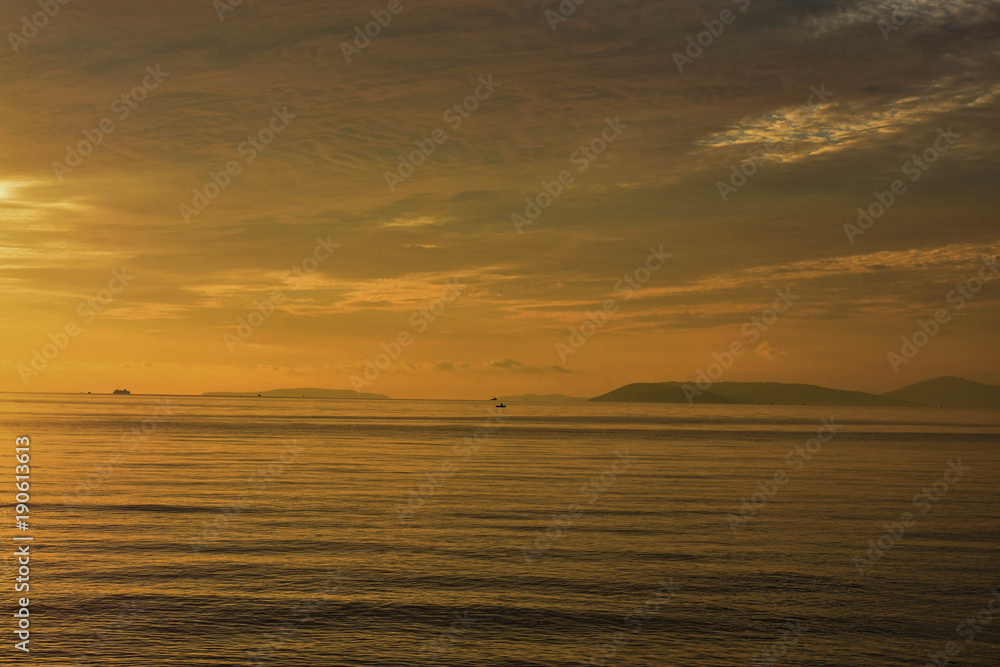 Beautiful panoramic sea view at islands in golden orange tones