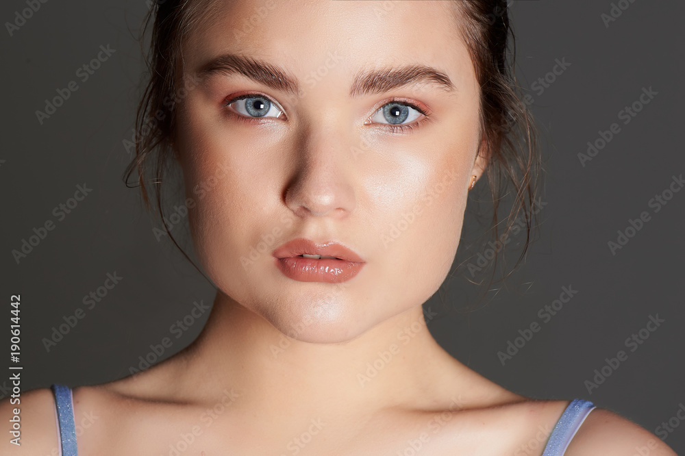 Beauty portrait of beautiful young brunette with clean skin. Care about beauty and health. Beauty portrait of beautiful young brunette with clean skin. Care about beauty and health.