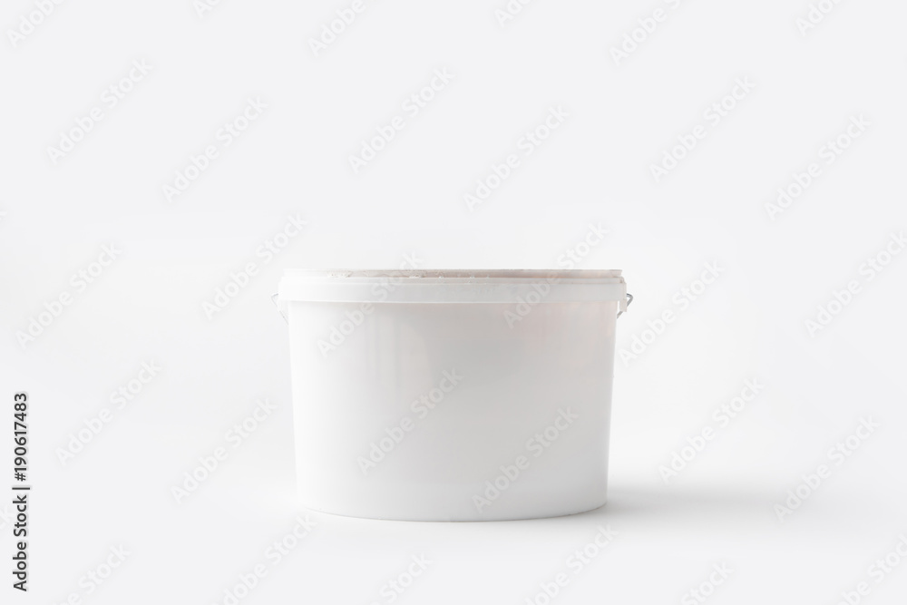 one plastic bucket with paint isolated on white one plastic bucket with paint isolated on white
