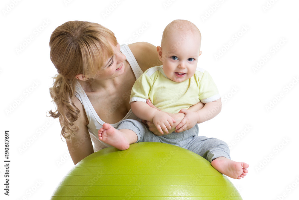 Mother and baby doing gymnastics on a large ball Mother and baby doing gymnastics on a large ball