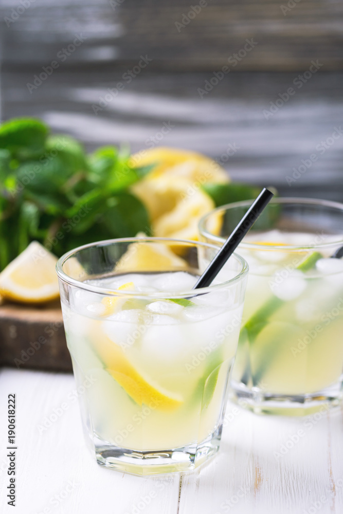 Italian lemon lime liqueur limoncello with ice and mint Italian lemon lime liqueur limoncello with ice and mint
