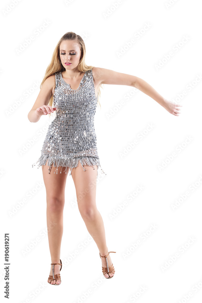 Fototapeta premium Sexy blonde woman dancing in scale sequin party dress. Full body length portrait isolated on white studio background.
