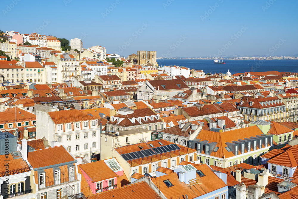 The residential houses of Alfama with Tejo river on the background. Lisbon. Portugal