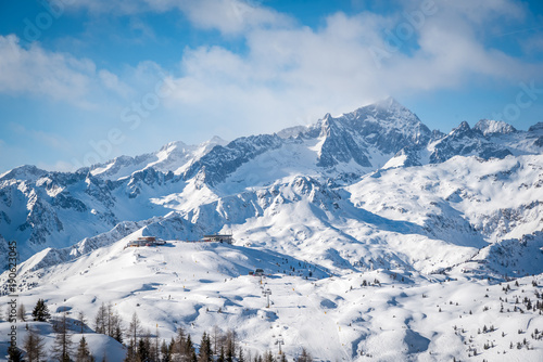 Snowy mountain in a sunny day - the Alps.