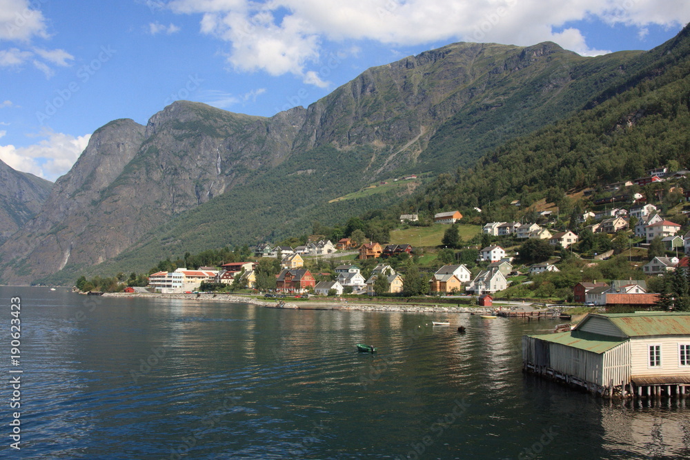 The village is located on the east side of the Aurlandsfjorden where the Aurlandselvi river flows into the fjord