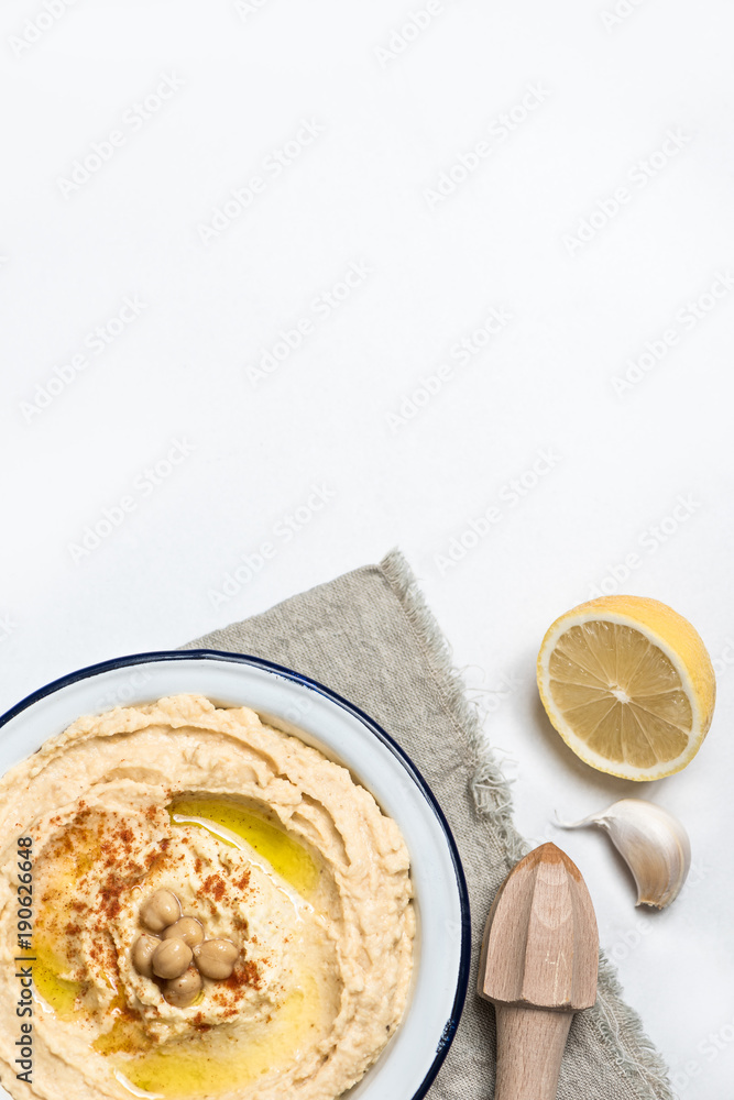 Chick-pea classic hummus in a dish with olive oil and paprika. Top view copy space. Chick-pea classic hummus in a dish with olive oil and paprika. Top view copy space.