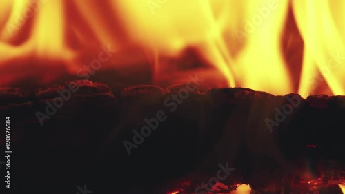 closeup fire flames in fireplace slow motion photo