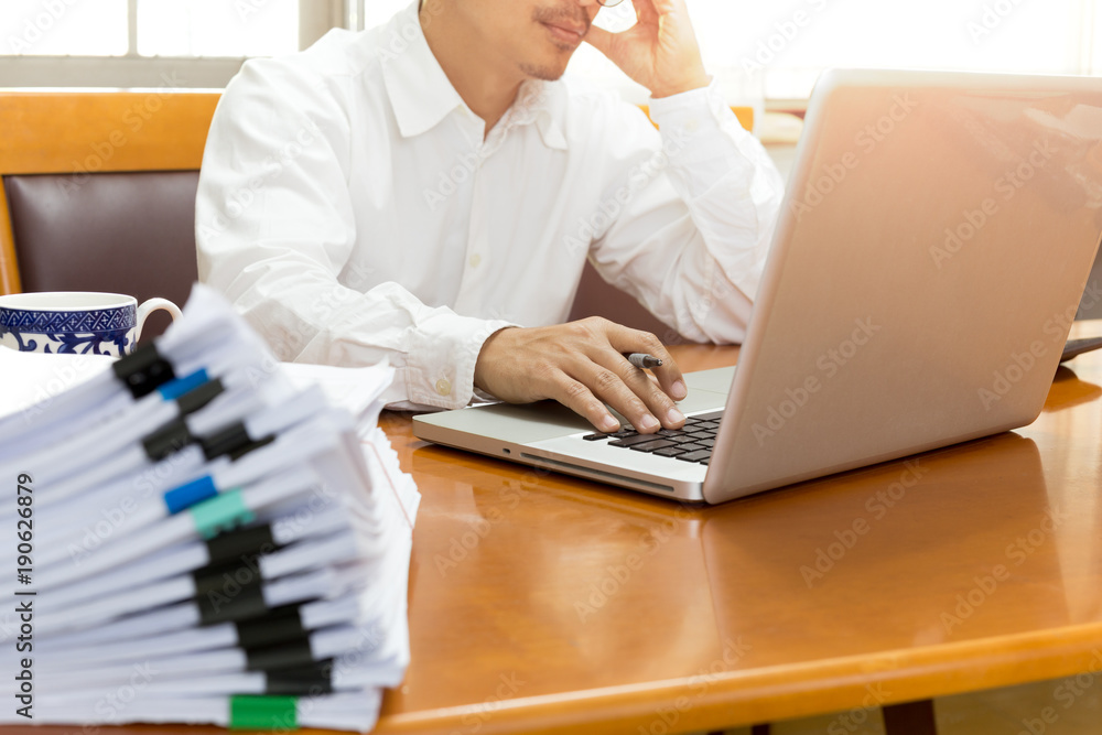 Businessman man hand holding his head looking worried Businessman man hand holding his head looking worried