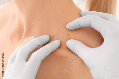 Oncologist examining female patient, closeup. Cancer awareness