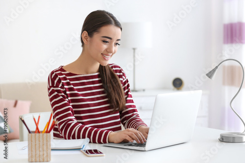 Young woman working in home...