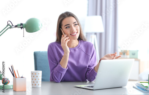 Young woman working in home...