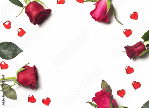 Roses and hearts arranged on a white background