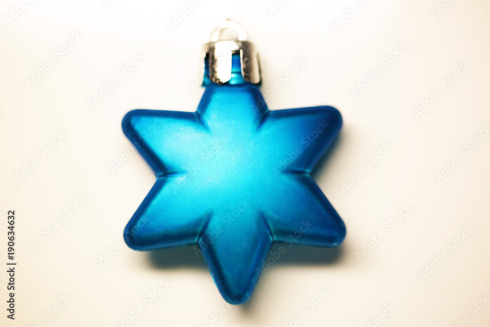 Blue chrismas ornament of star shape close up new year background Blue chrismas ornament of star shape close up new year background
