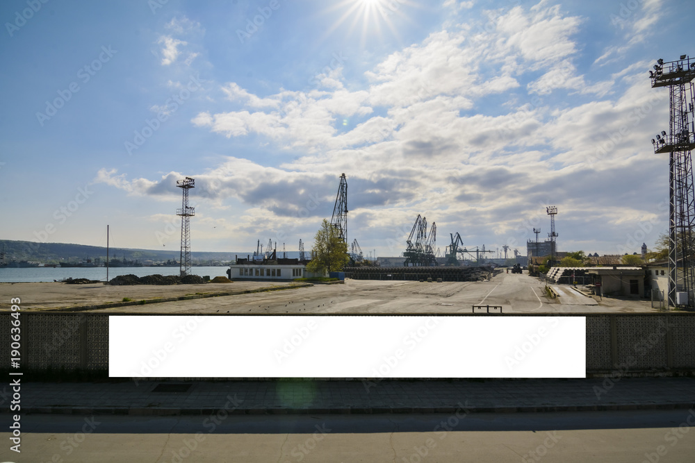 Obraz premium billboard in the seaport fences