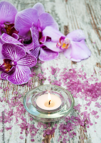 Candle with orchids
