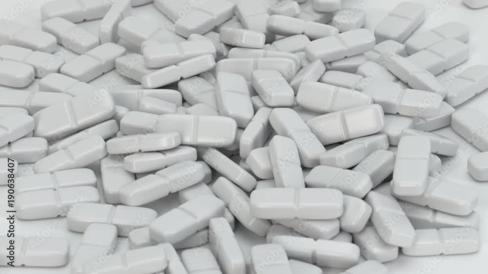 Weiße Tabletten - Pillen fallen auf den Boden Weiße Tabletten - Pillen fallen auf den Boden