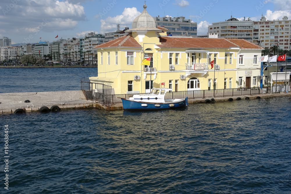 Yellow building of the Passport Ferry Terminal in Izmir Bay.