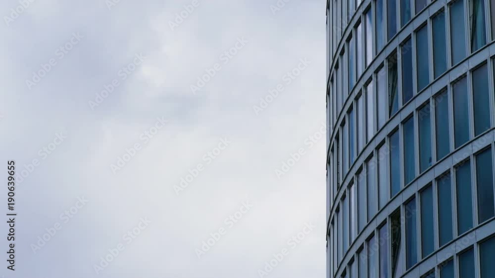 clouds flowing reflected on Glass Business Building- timelapse clouds flowing reflected on Glass Business Building- timelapse