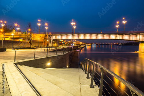 Night view on the Slasko-Dabrowski bridge over the Vistula river and boulevards , Warsaw, Poland photo
