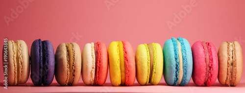 Bright food photography of macroons on pink background photo