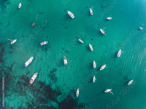 Beautiful aerial view of boats and emerald water