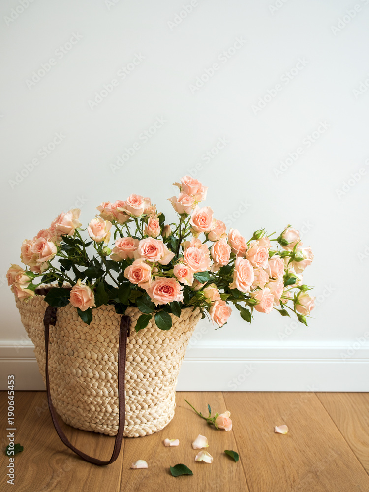 ECO-friendly shopping bag woven with roses on a light background walls on the floor