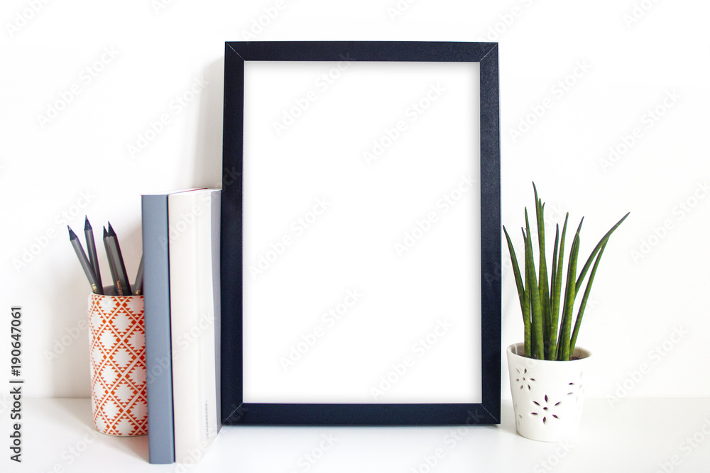 A4 black portrait frame on desk Stock Photo Adobe Stock