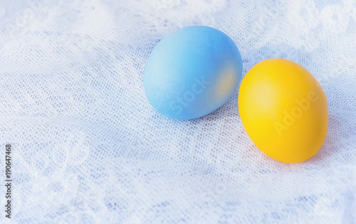 Two Painted Easter Eggs On A Lace