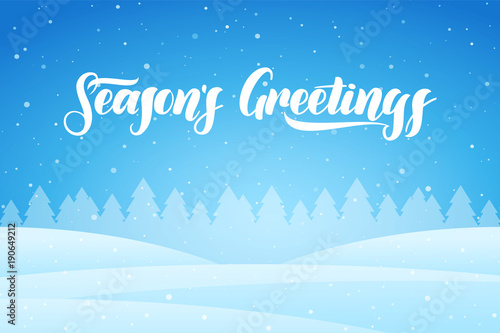 Snowy winter background with forest and handwritten lettering of Season's Greetings
