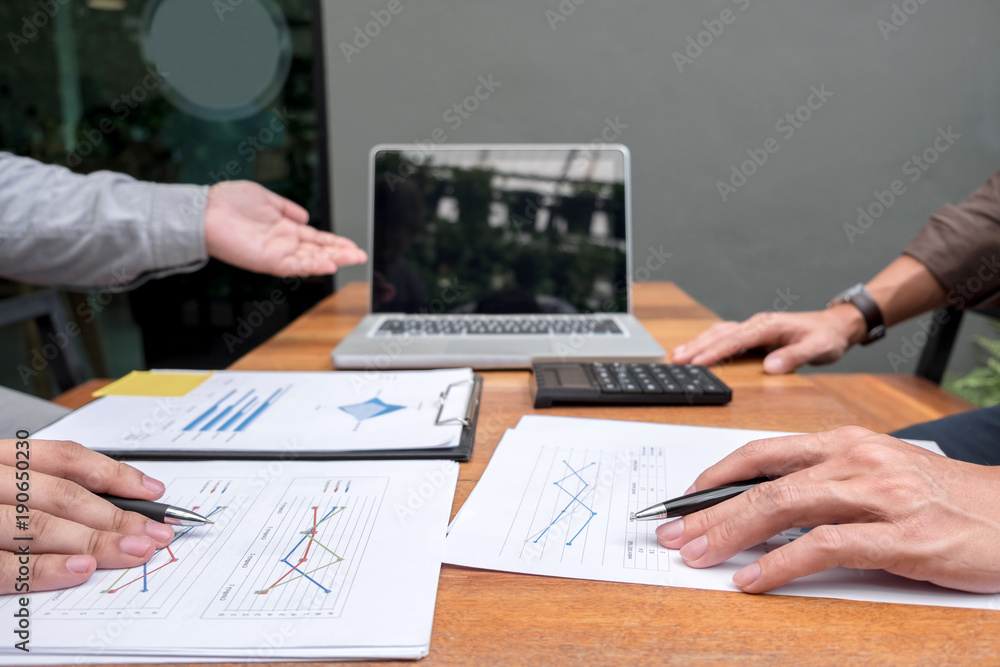 Two confident executives business colleagues meeting and discussing ideas of project about company offer, they is pointing on a contract and giving explanations, team of successful business people Two confident executives business colleagues meeting and discussing ideas of project about company offer, they is pointing on a contract and giving explanations, team of successful business people