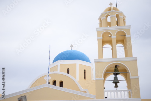 Old blue dome church in Santorini. Place for text