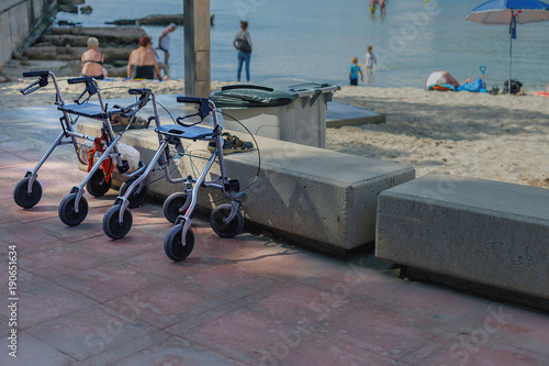 a device to facilitate walking of people with disabilities on the beach background photo