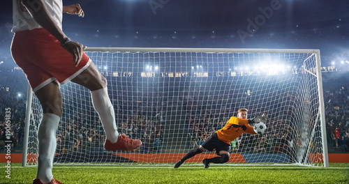 Soccer goalkeeper in action on the stadium photo