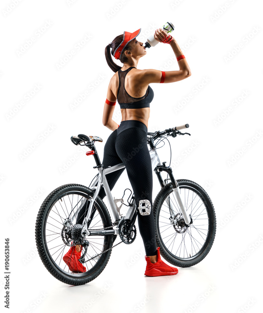 Naklejka premium Girl cyclist with bicycle drinking a water in silhouette on white background. Rear view. Sport and healthy lifestyle