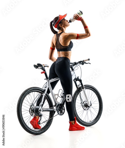 Girl cyclist with bicycle drinking a water in silhouette on white background. Rear view. Sport and healthy lifestyle