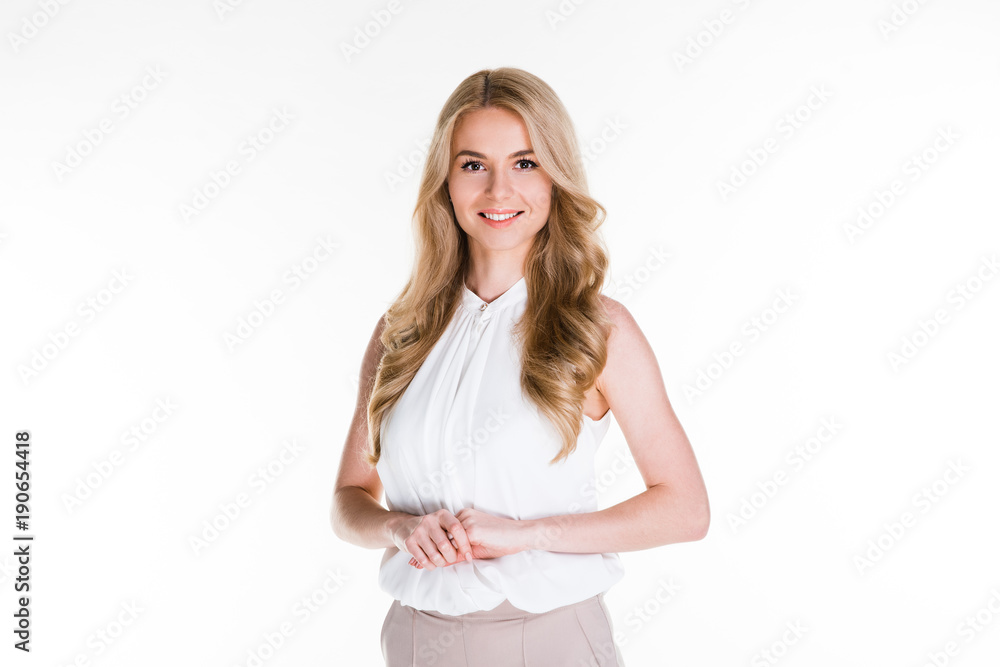 Can I help you? Beautiful young woman looking at camera with smile while standing against white background Can I help you? Beautiful young woman looking at camera with smile while standing against white background