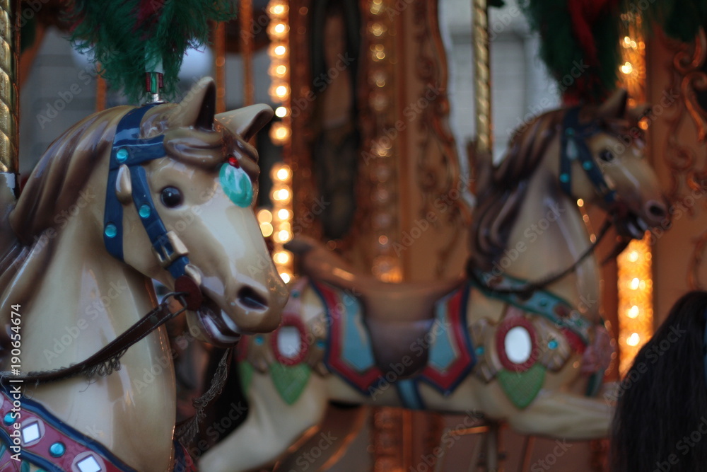 Detail of an antique carousel with horses, taken in the center of Florence.