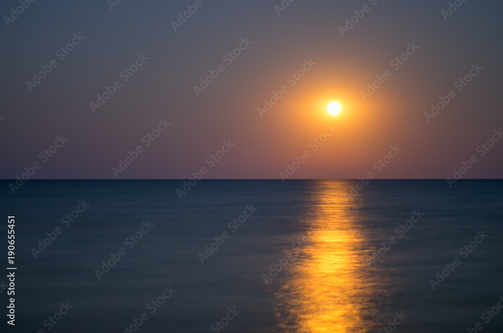 moon in the night sky, sea horizon, calm, reflection