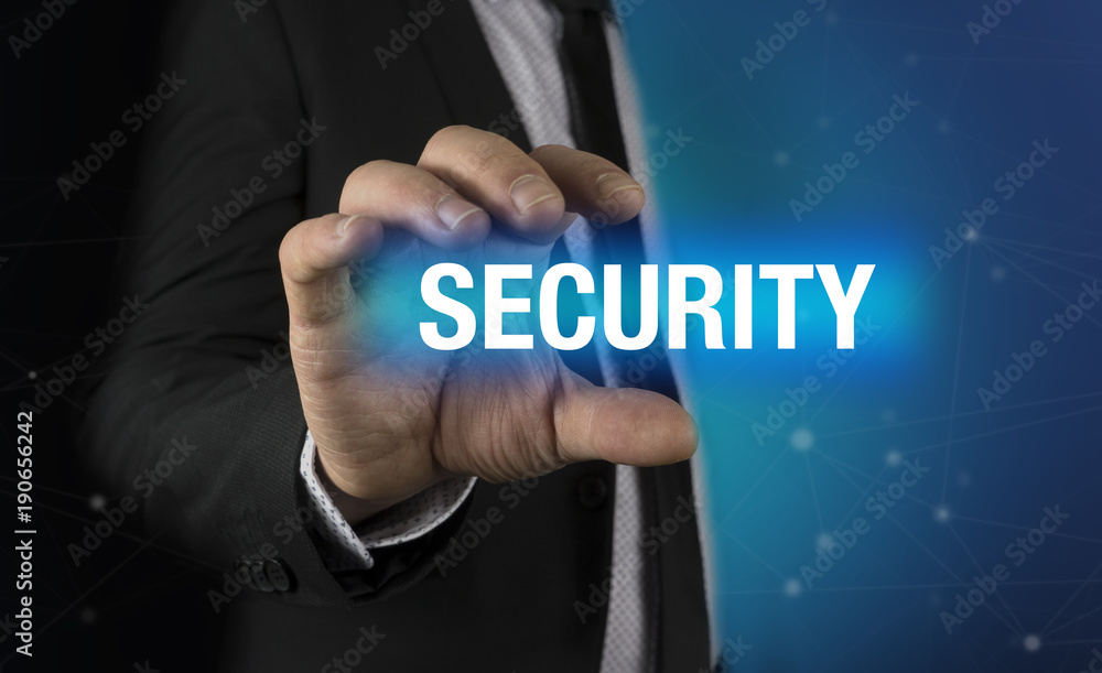 Businessman with security concept in his hands Businessman with security concept in his hands