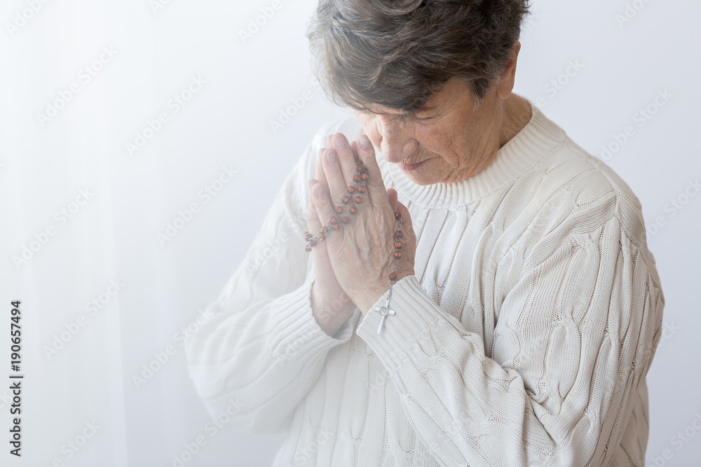 Fototapeta premium Believing senior person praying
