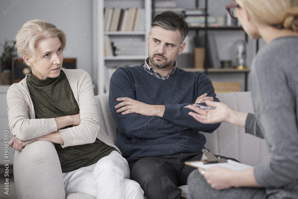 Tired woman talking to mediator Tired woman talking to mediator