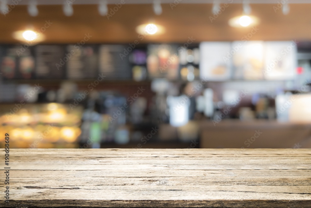 Wood table top on coffee cafe counter bar background Wood table top on coffee cafe counter bar background
