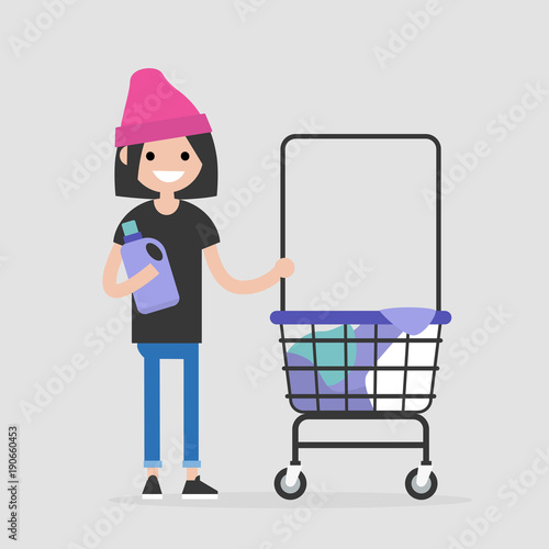 Daily routine. Young female character washing clothes in a public coin laundry. Flat editable vector illustration, clip art