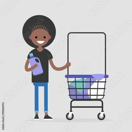 Daily routine. Young black character washing clothes in a public coin laundry. Flat editable vector illustration, clip art
