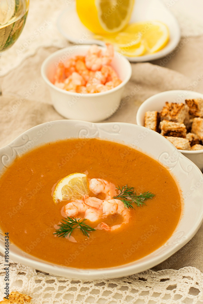 French traditional fish soup bisque with lobster and shrimps